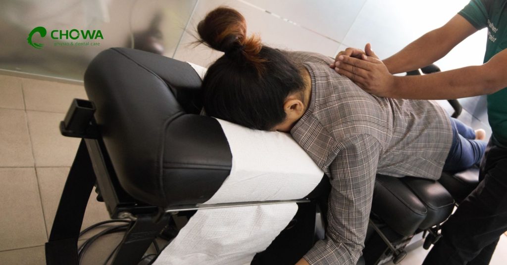 Physiotherapy for chronic pain with guided leg stretching treatment on a modern rehab table