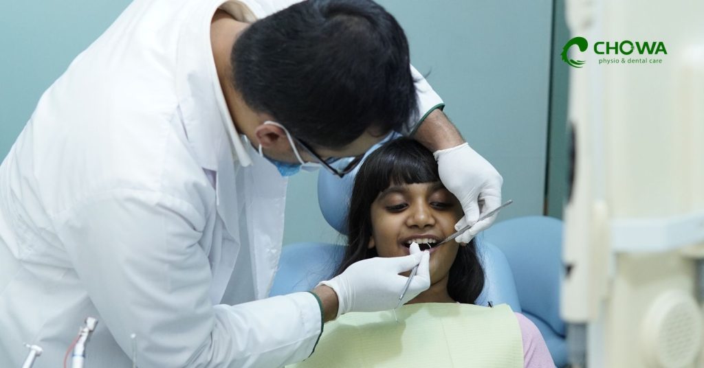 Cosmetic Dentistry care for children with dentist examining young patient at Chowa dental clinic