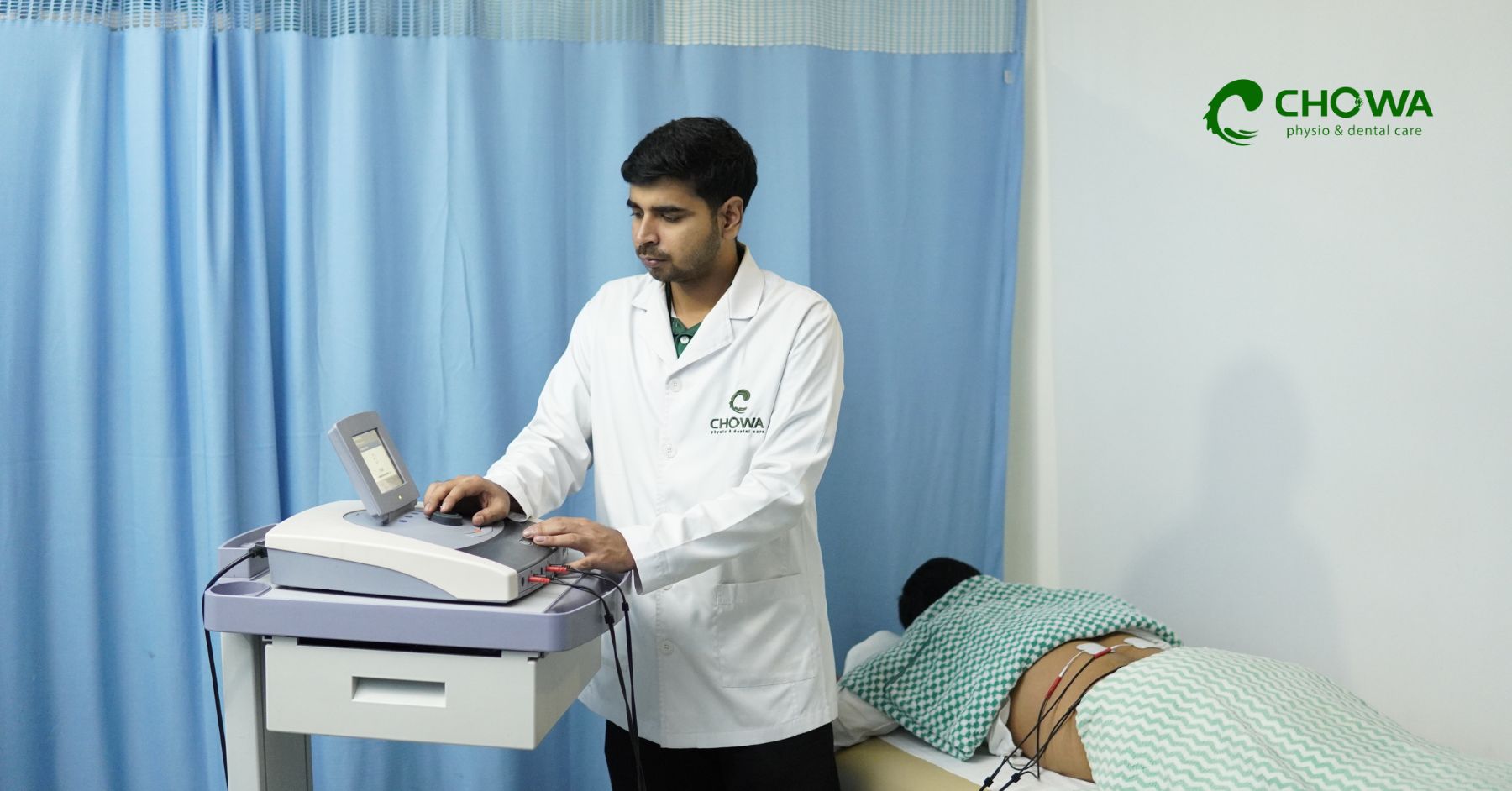 Physiotherapy Services in Gulshan at Chowa, therapist preparing patient for electrotherapy back care