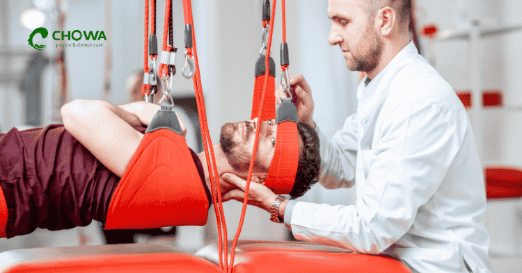 Therapist guiding leg movement in neurological physiotherapy in Dhaka