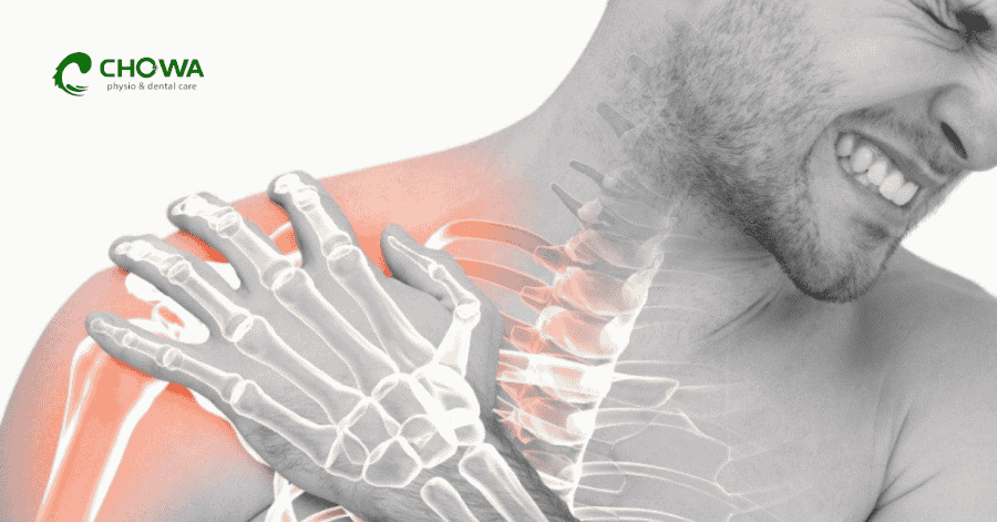 Man holding painful shoulder for frozen shoulder physiotherapy in Gulshan assessment